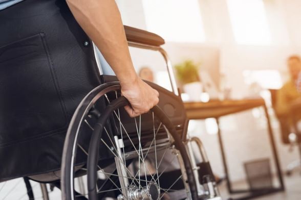 person in a wheelchair after a paralyzing injury